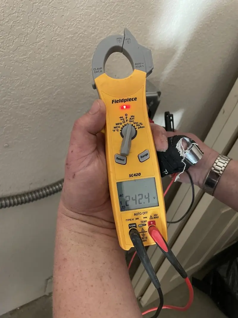 Voltage testing with clamp meter during Ceiling Fan Installation in Taneytown